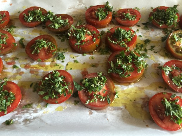 Sliced fresh tomatoes with salt, pepper, herbs, olive oil